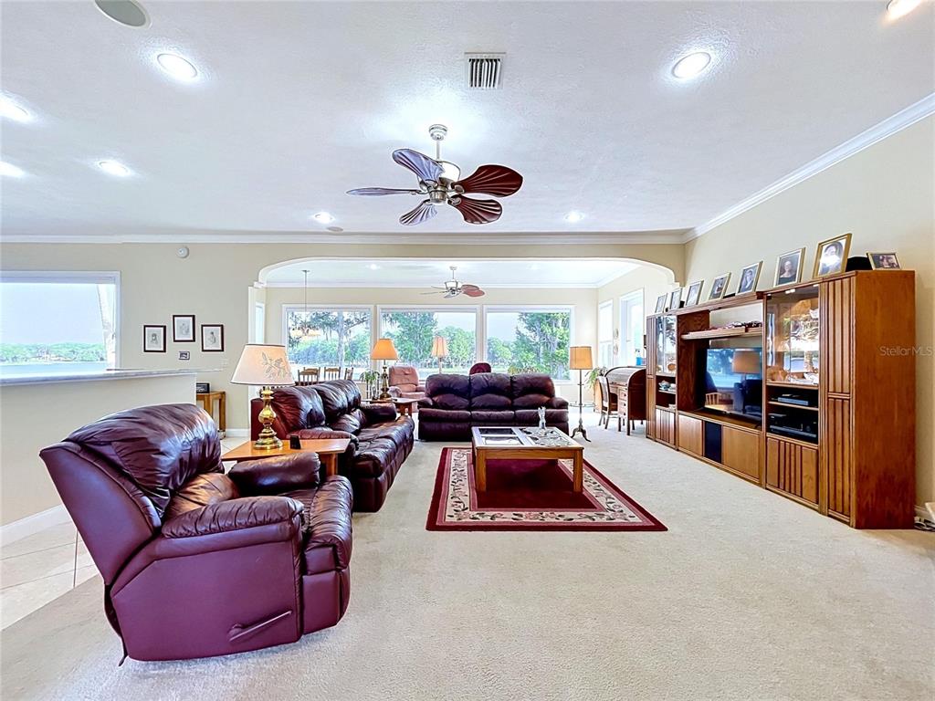 1360 South Waterview Drive Inverness, FL 34450 - Photo 37 of 100 a living room with furniture a flat screen tv and a large window