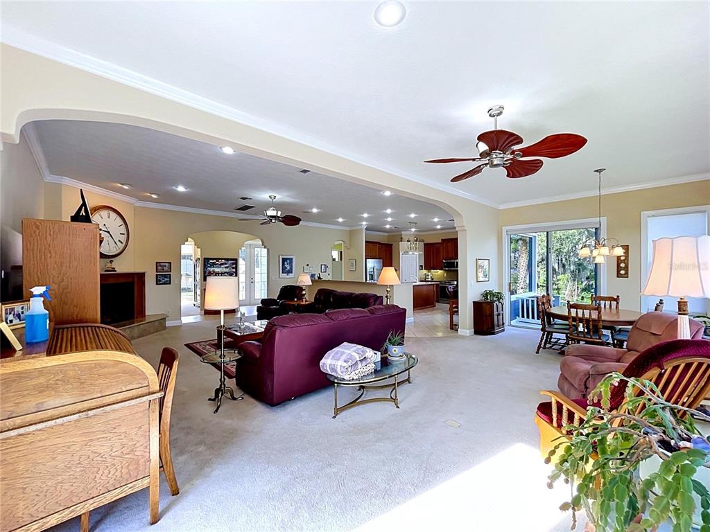 1360 South Waterview Drive Inverness, FL 34450 - Photo 39 of 100 a living room with furniture gym equipment and a large window