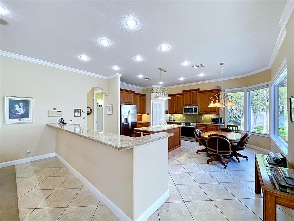 1360 South Waterview Drive Inverness, FL 34450 - Photo 43 of 100 a view of kitchen with kitchen island dining table and chairs