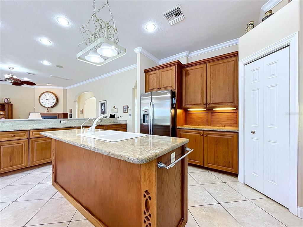 1360 South Waterview Drive Inverness, FL 34450 - Photo 51 of 100 a kitchen with stainless steel appliances granite countertop a refrigerator a sink a stove and island