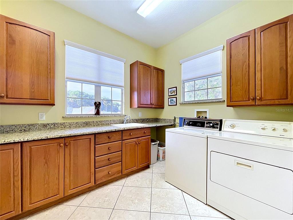 1360 South Waterview Drive Inverness, FL 34450 - Photo 54 of 100 a kitchen with sink cabinets and window