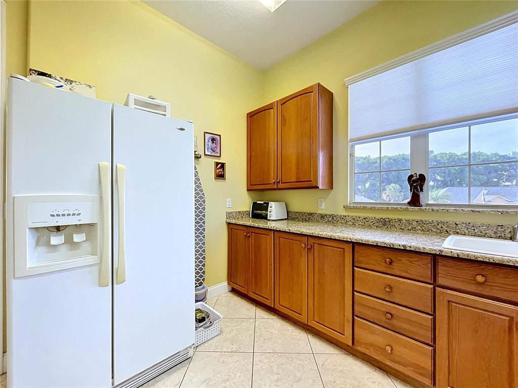 1360 South Waterview Drive Inverness, FL 34450 - Photo 56 of 100 a kitchen with stainless steel appliances granite countertop a refrigerator and a sink