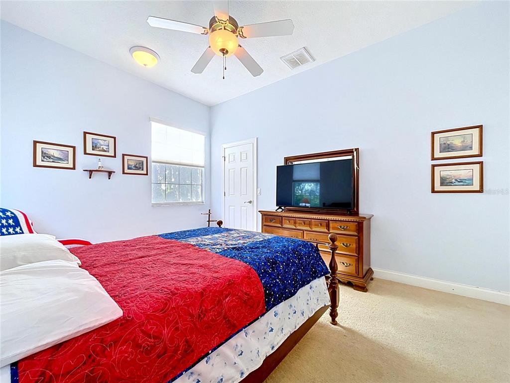 1360 South Waterview Drive Inverness, FL 34450 - Photo 59 of 100 a bedroom with a bed and a flat screen tv