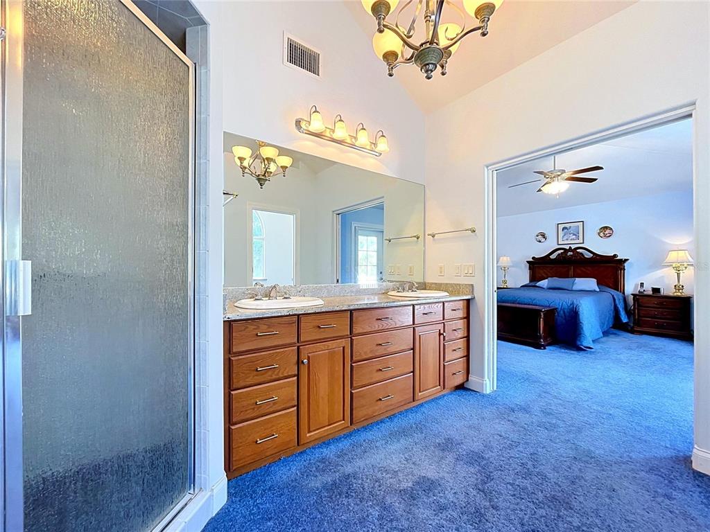 1360 South Waterview Drive Inverness, FL 34450 - Photo 81 of 100 a spacious bathroom with a double vanity sink and a mirror