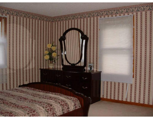 108 Carr Street Springfield, MA 01118 - Photo 5 of 6 a bedroom with a bed and a dresser