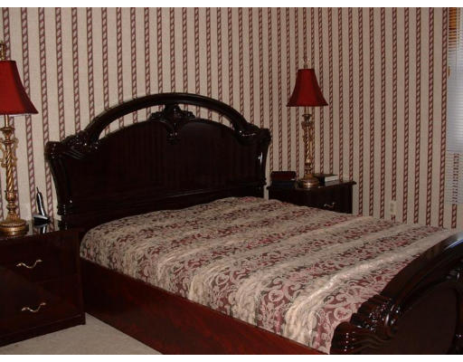 108 Carr Street Springfield, MA 01118 - Photo 6 of 6 a bedroom with a bed and a dresser