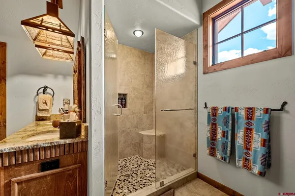 a bathroom with a tub and shower