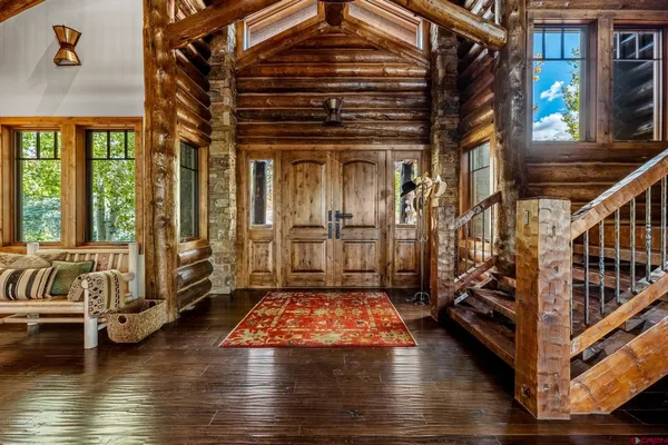 a area with wooden floor and furniture
