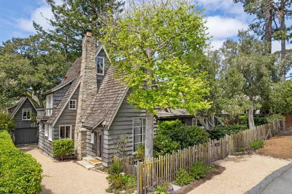 a front view of a house with trees