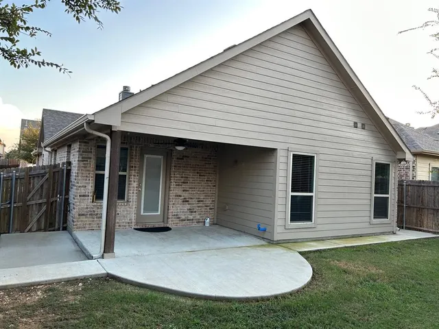 a view of a house with a small yard