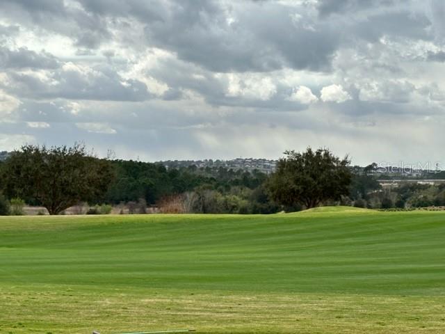 a view of a golf course with a big yard