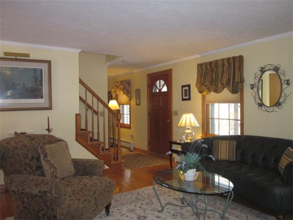 16 Parish Road Georgetown, MA 01833 - Photo 3 of 30 a living room with furniture or couch and a chandelier