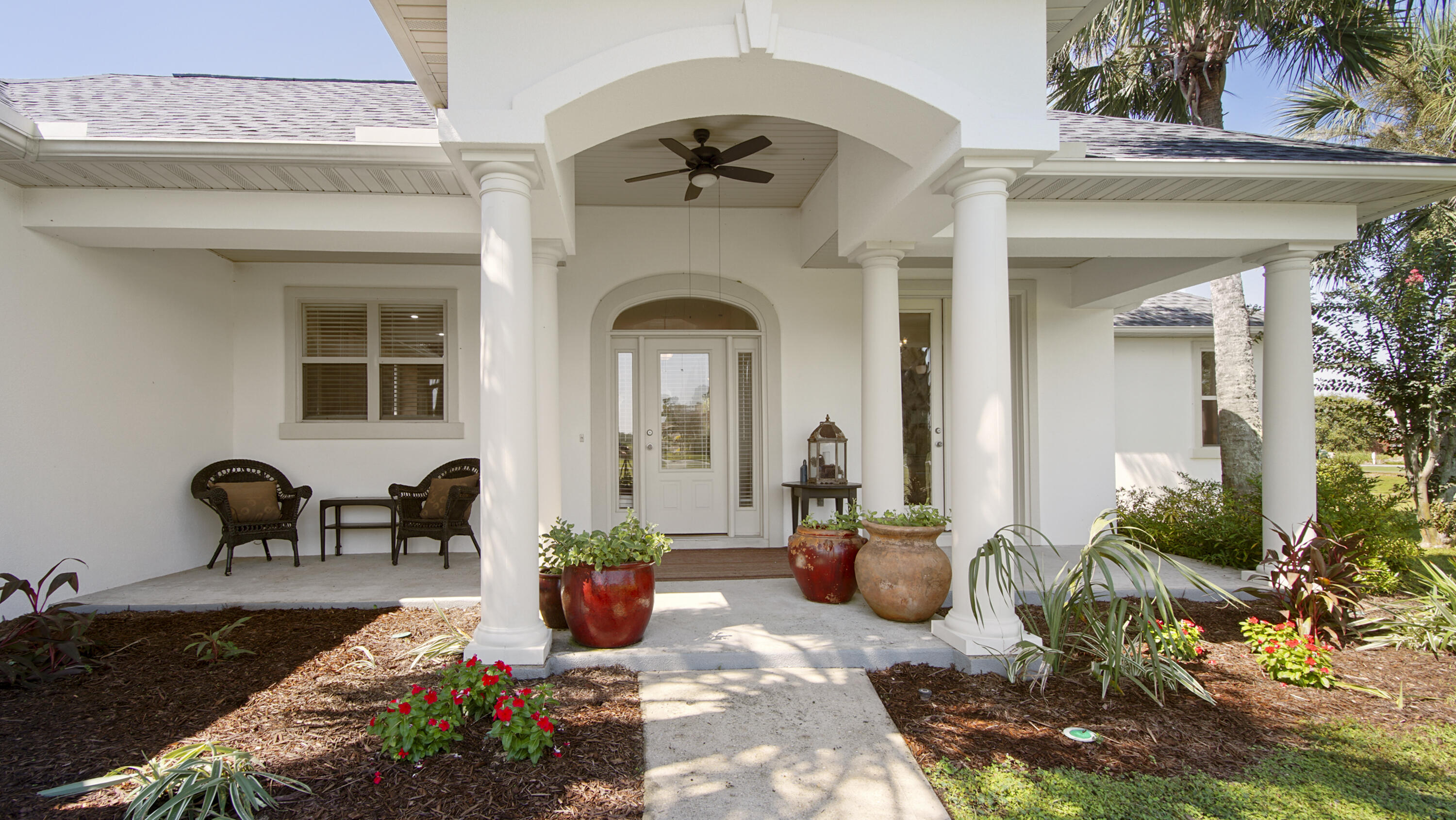 1464 Brushed Dune Circle Freeport, FL 32439 - Photo 2 of 62 a view of a patio with table and chairs potted plants