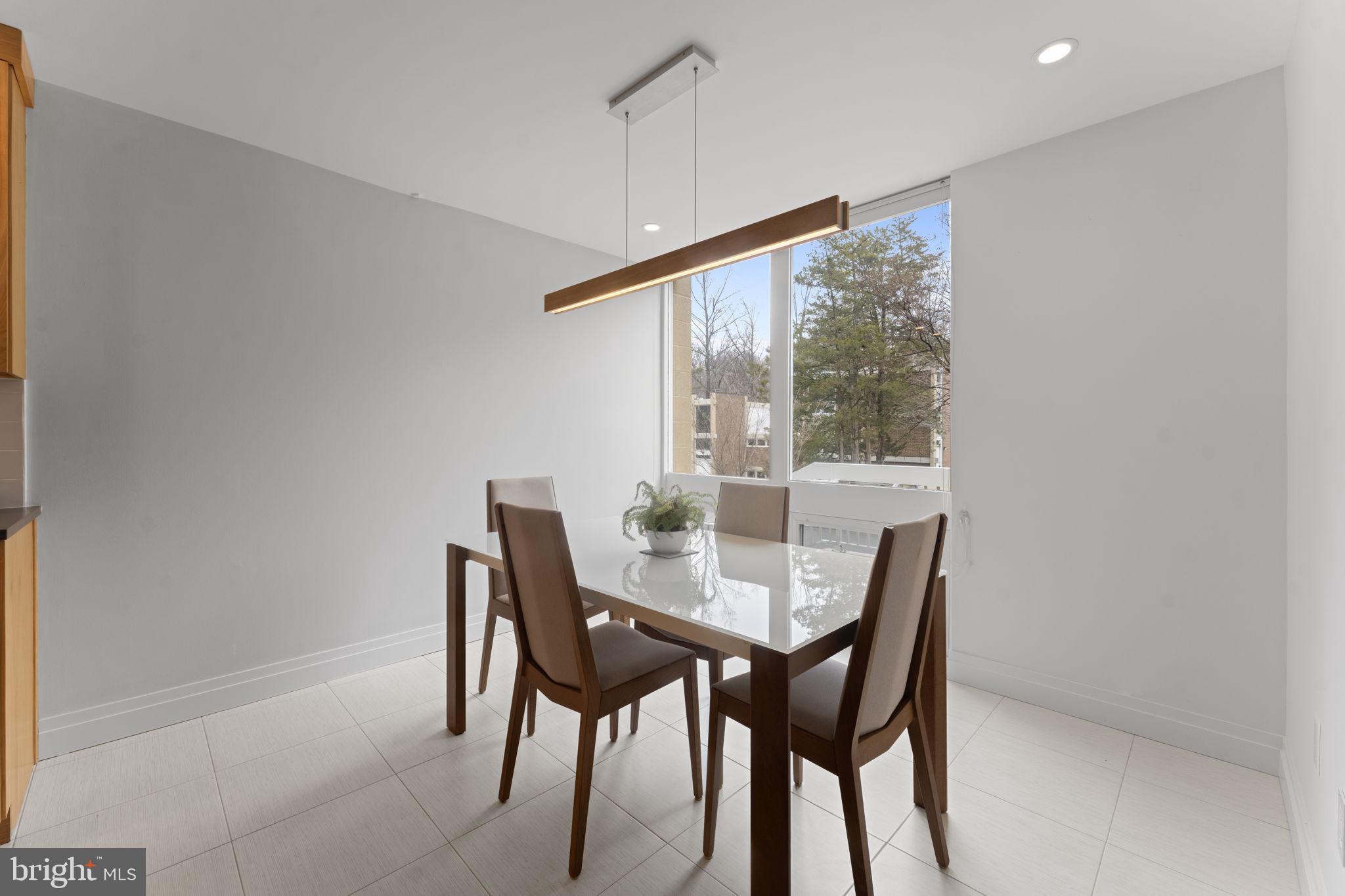 11587 Maple Ridge Road Reston, VA 20190 - Photo 16 of 119 a view of a dining room with furniture window and outside view