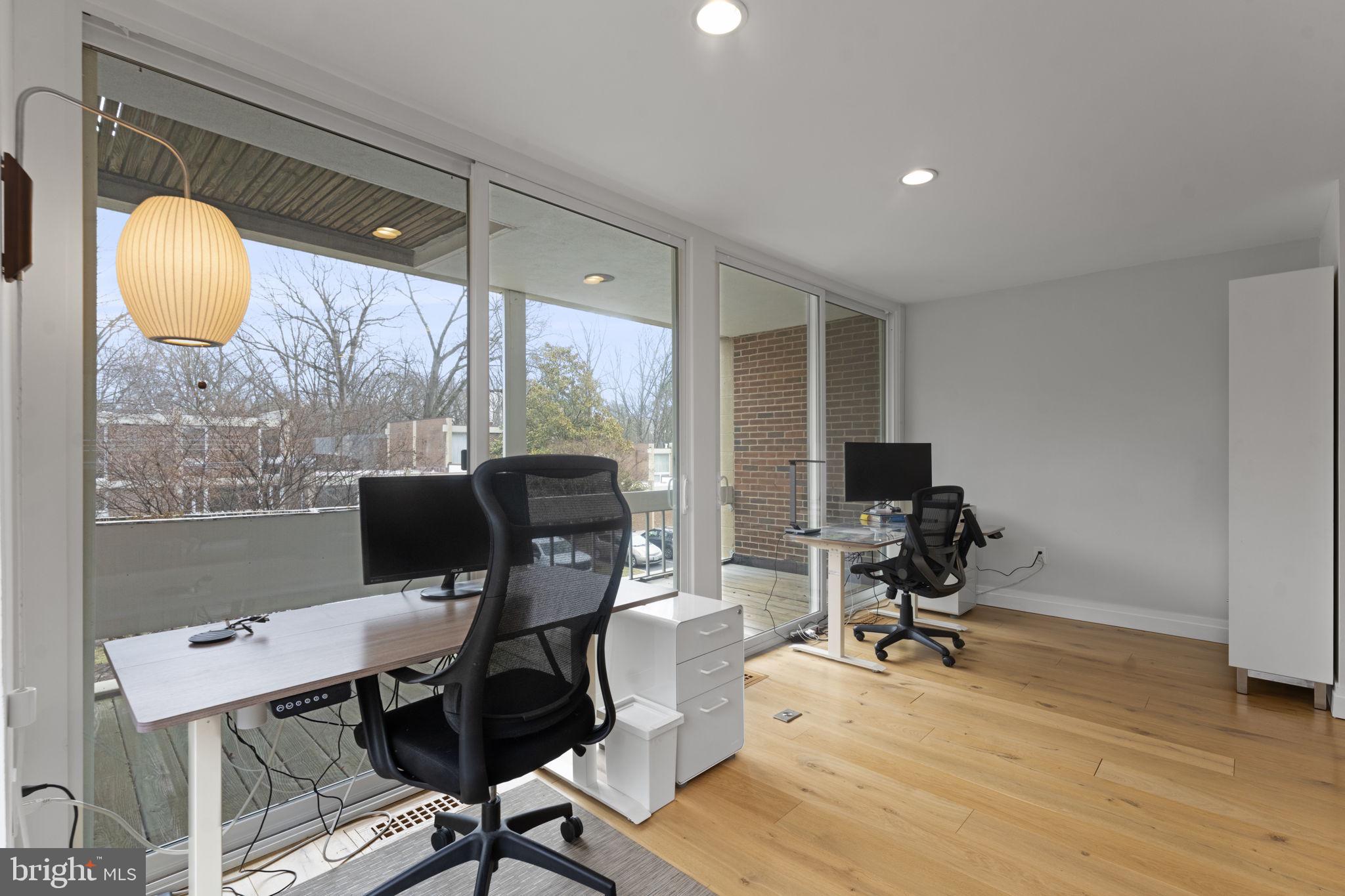11587 Maple Ridge Road Reston, VA 20190 - Photo 27 of 119 a view of a workspace with furniture and a window