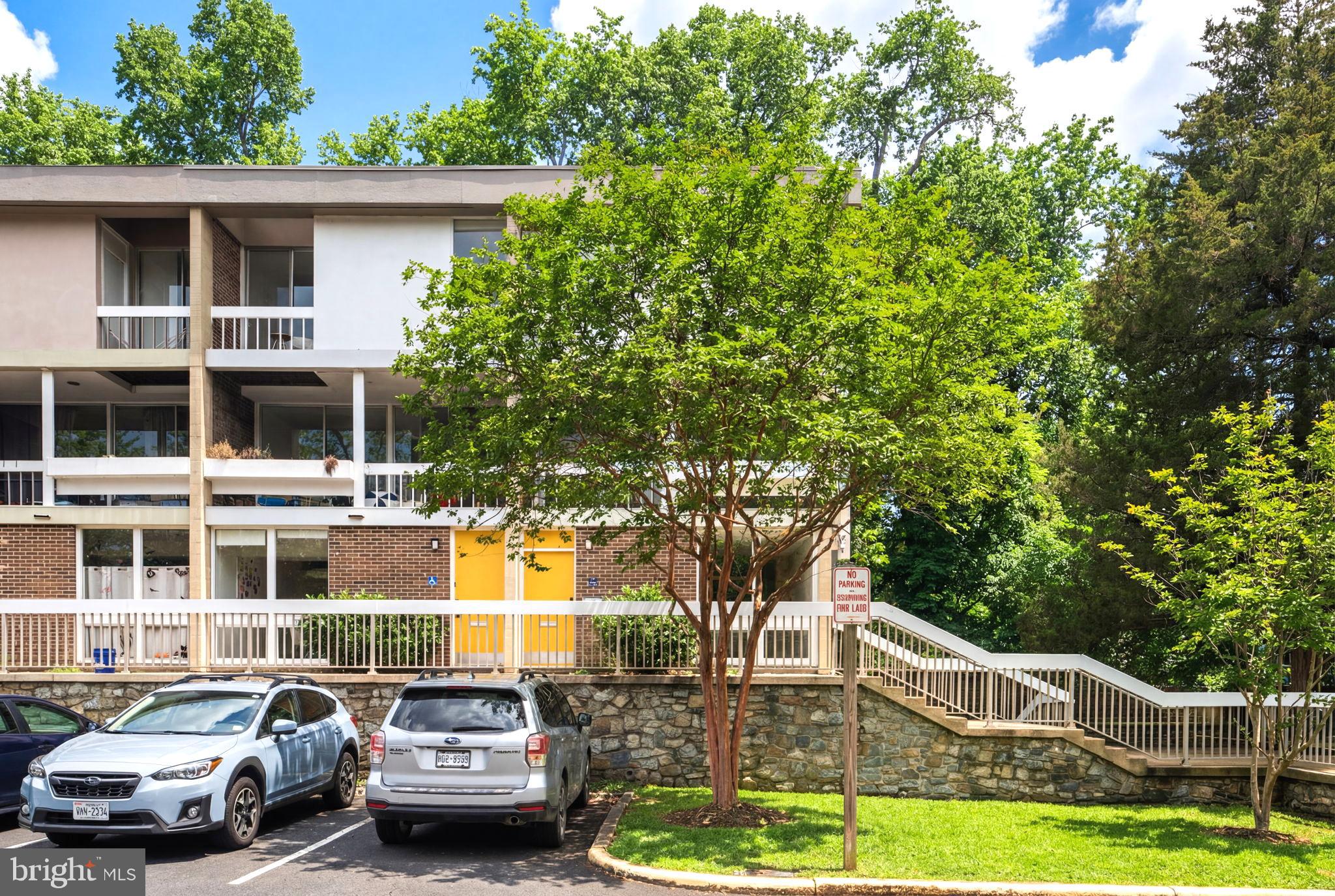 11587 Maple Ridge Road Reston, VA 20190 - Photo 43 of 119 a front view of a house with a garden
