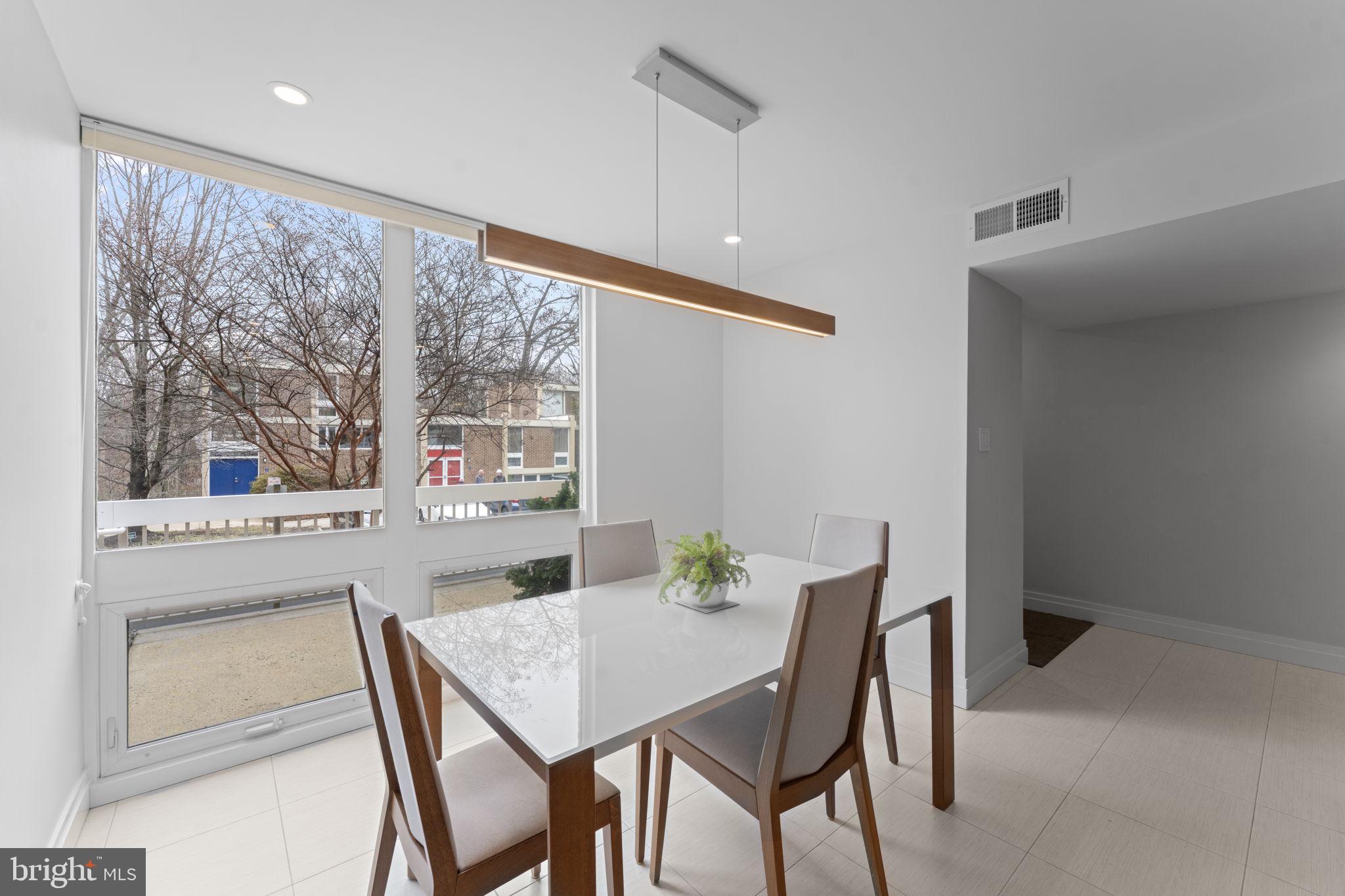 11587 Maple Ridge Road Reston, VA 20190 - Photo 53 of 119 a view of a dining room with furniture window and outside view