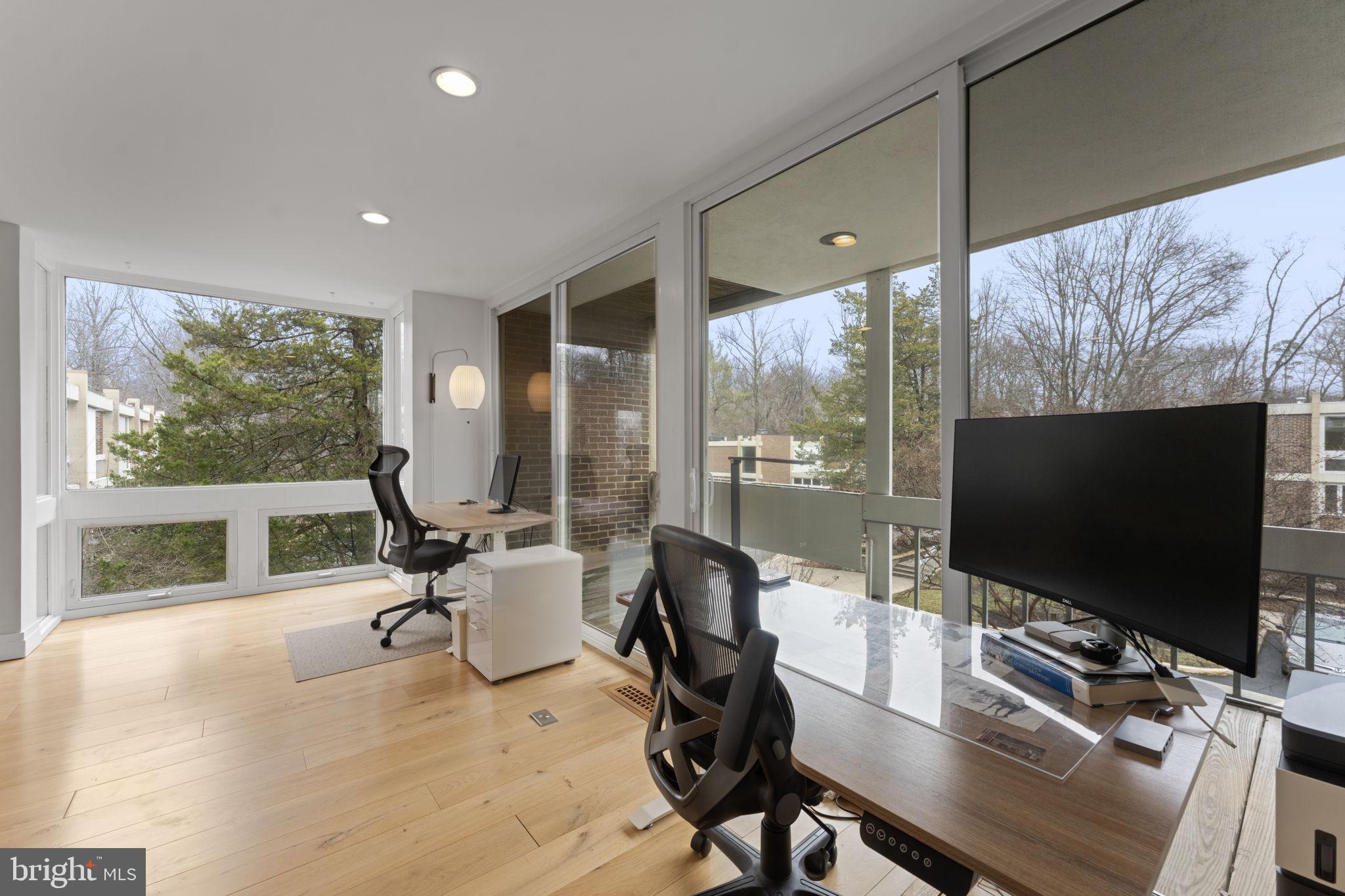 11587 Maple Ridge Road Reston, VA 20190 - Photo 59 of 119 a living room with furniture tv and a large window