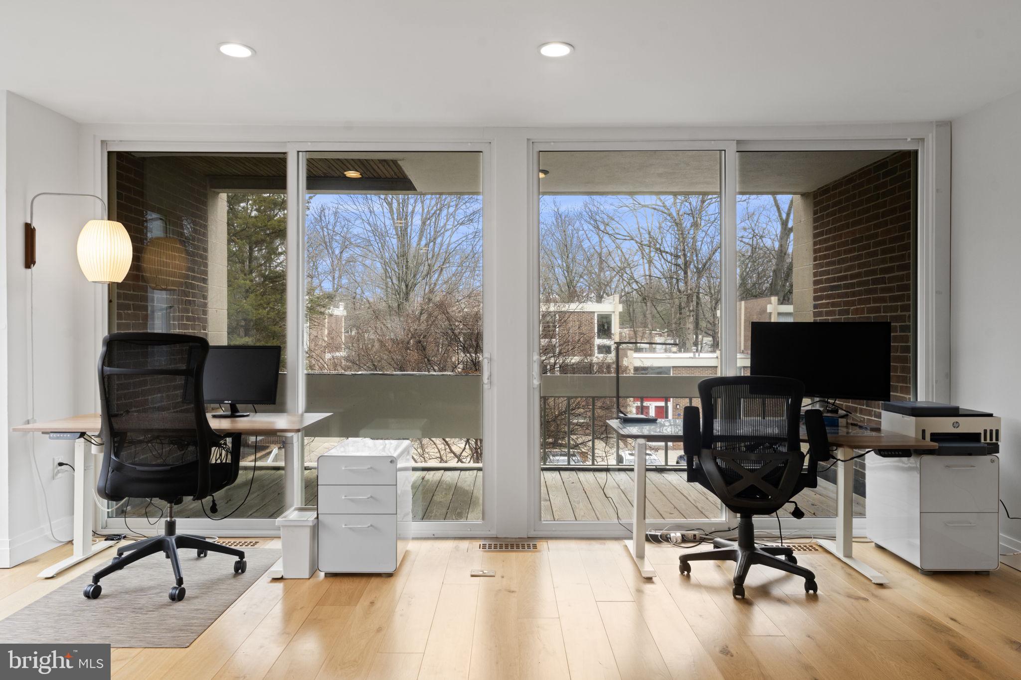 11587 Maple Ridge Road Reston, VA 20190 - Photo 61 of 119 a view of a workspace with furniture and a window