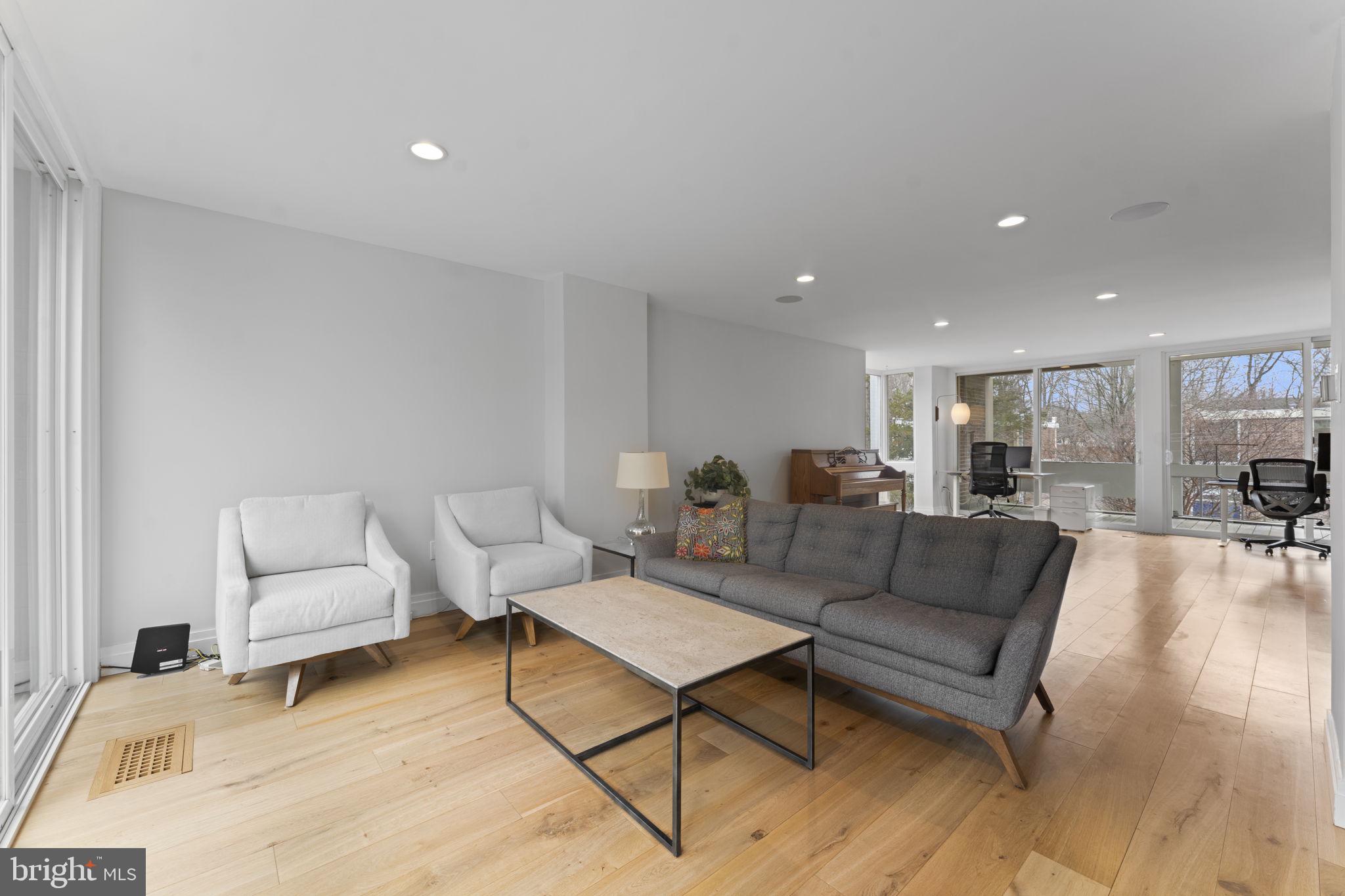 11587 Maple Ridge Road Reston, VA 20190 - Photo 63 of 119 a living room with furniture and a table