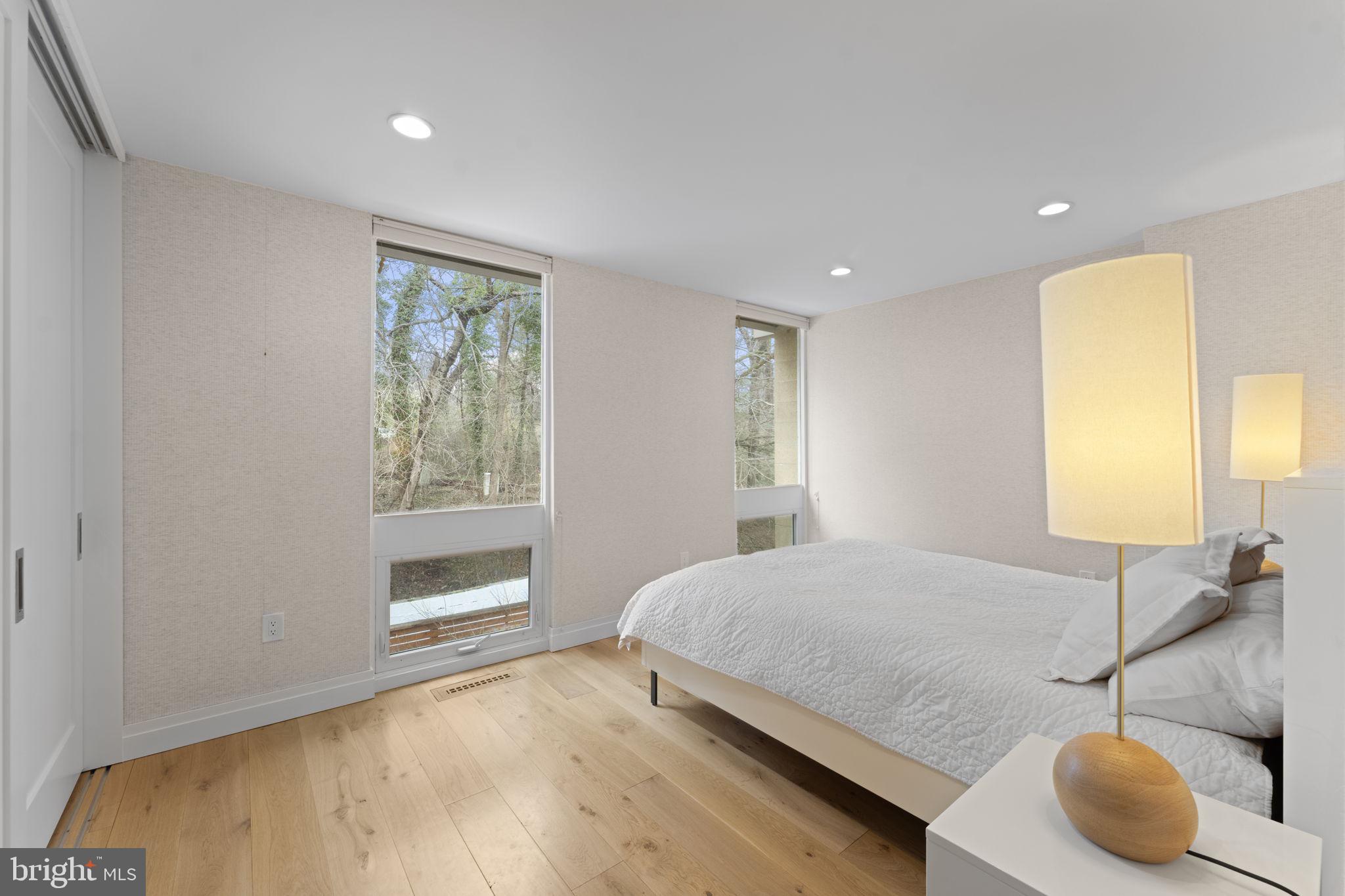 11587 Maple Ridge Road Reston, VA 20190 - Photo 66 of 119 a bedroom with a bed and a window