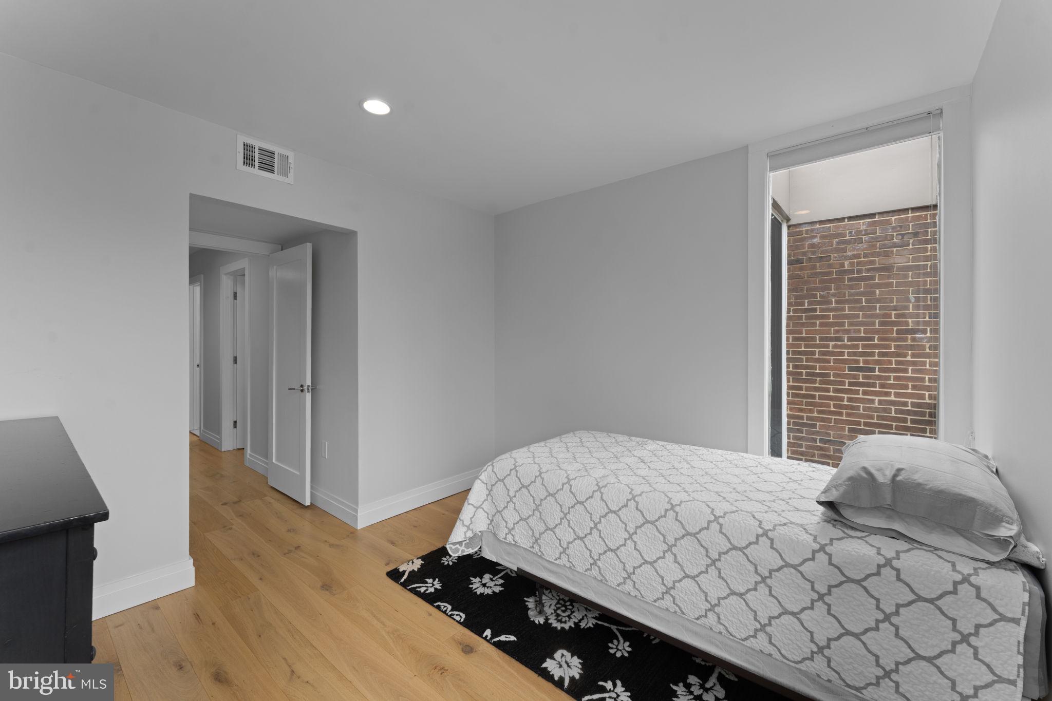 11587 Maple Ridge Road Reston, VA 20190 - Photo 76 of 119 a bedroom with a bed and a window