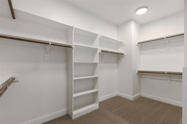 a view of an empty walk in closet