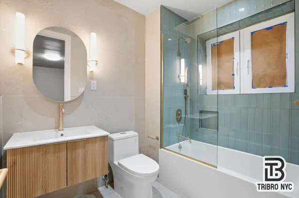 a bathroom with a sink a toilet and bathtub