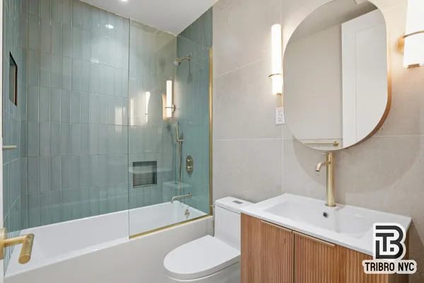 a bathroom with a sink a toilet and bathtub