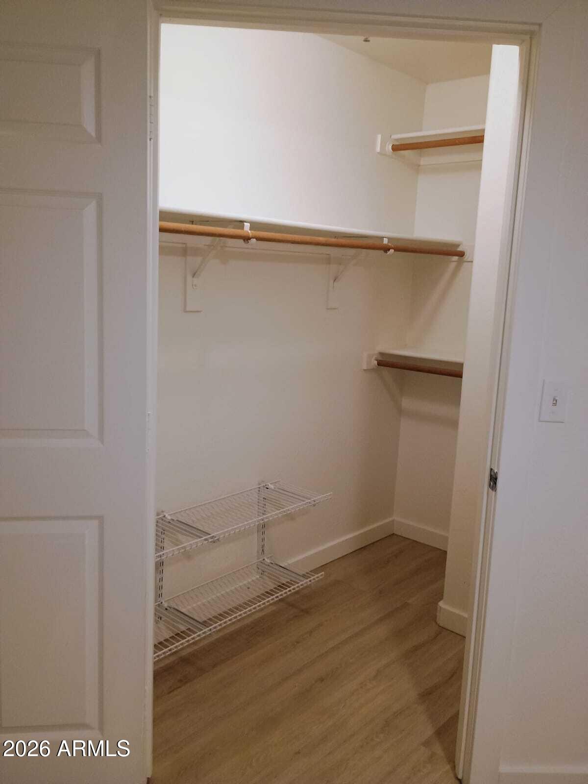 1287 North Alma School Road, Unit 259 Chandler, AZ 85224 - Photo 12 of 22 a view of walk in closet with empty racks