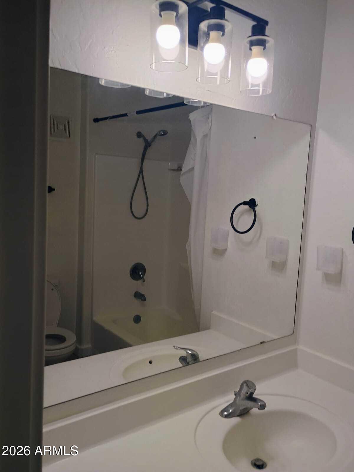 1287 North Alma School Road, Unit 259 Chandler, AZ 85224 - Photo 5 of 22 a bathroom with a sink and shower