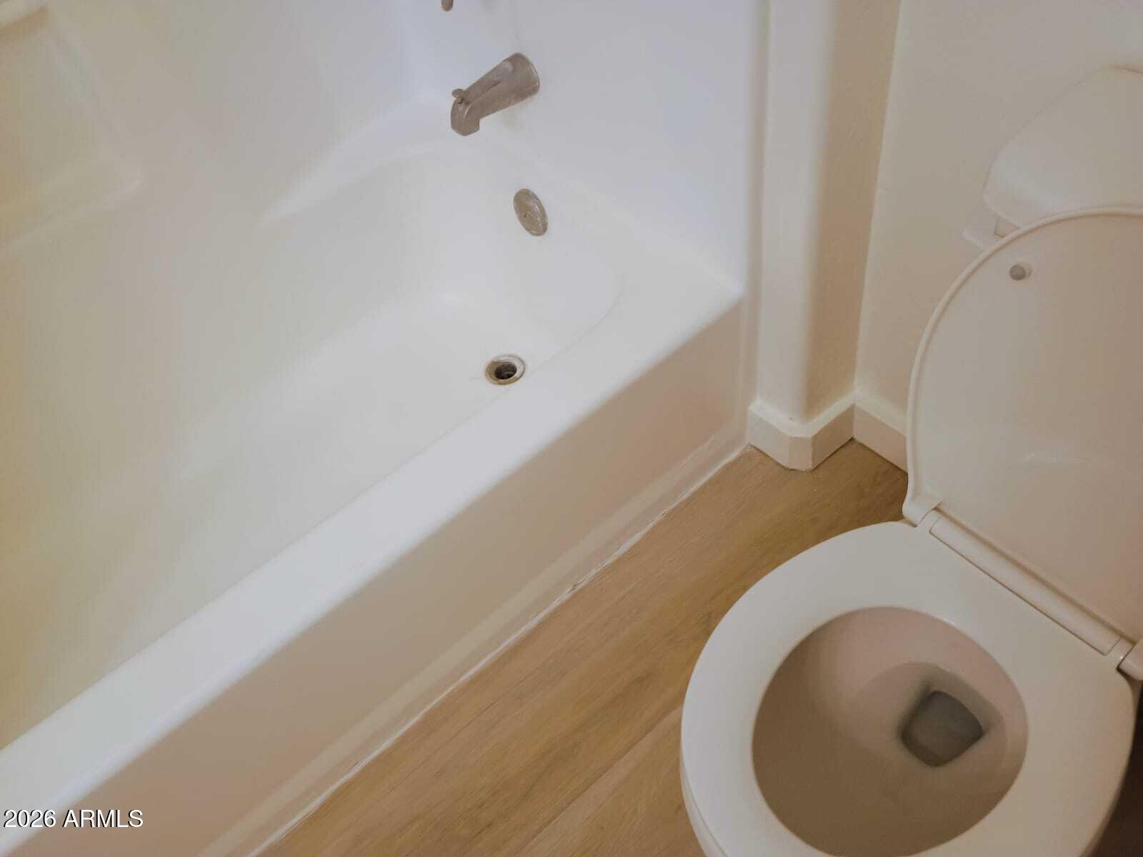 1287 North Alma School Road, Unit 259 Chandler, AZ 85224 - Photo 8 of 22 a bathroom with a toilet and a tub