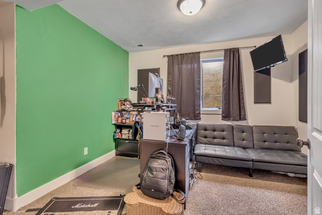 3054 West Ridgeline Road Stockton, UT 84071 - Photo 49 of 88 Living area featuring baseboards and a desk