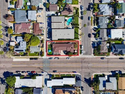 an aerial view of houses with outdoor space