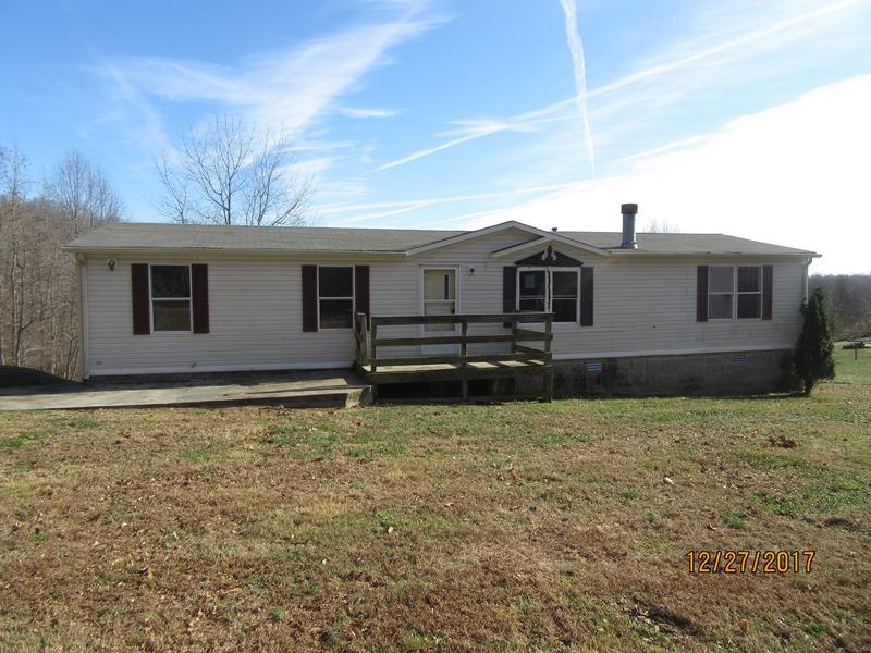 2408 Graham Cemetery Road Clarksville, TN 37043 - Photo 1 of 7 a house with trees in the background