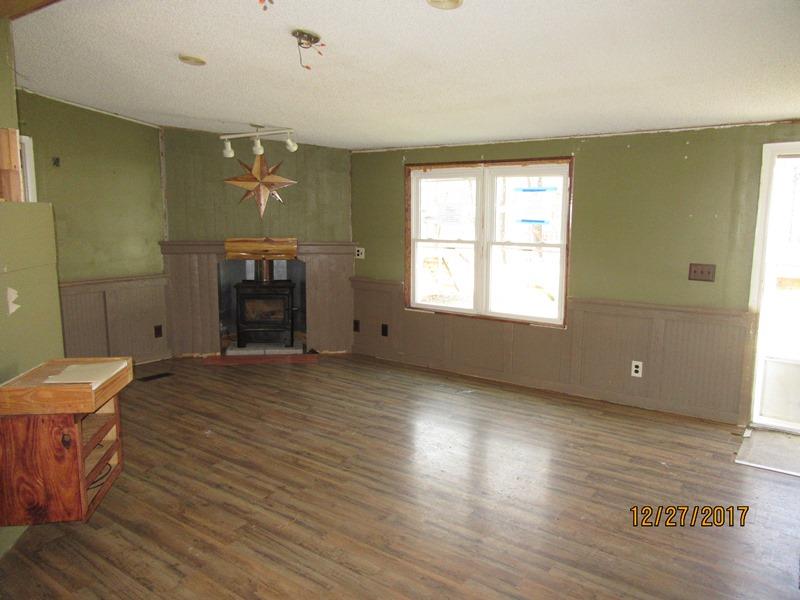2408 Graham Cemetery Road Clarksville, TN 37043 - Photo 2 of 7 a view of empty room with wooden floor and fan