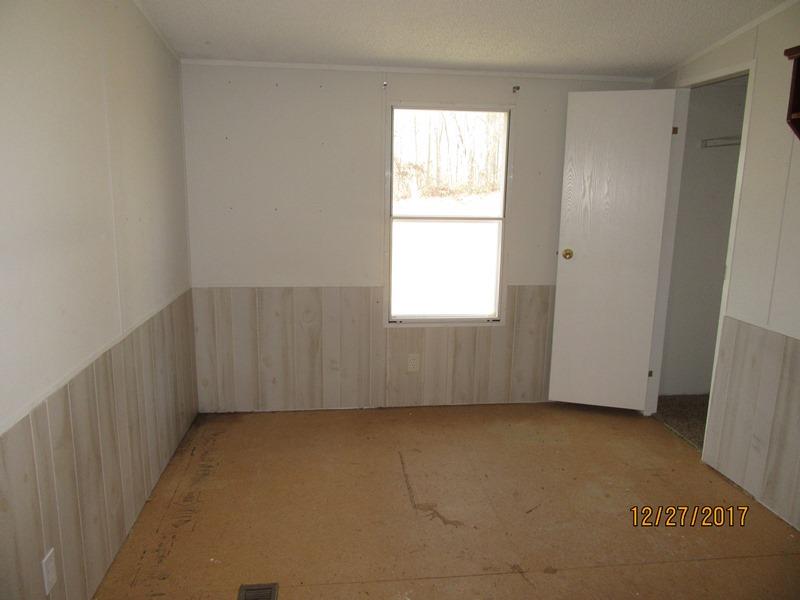 2408 Graham Cemetery Road Clarksville, TN 37043 - Photo 4 of 7 an empty room with a window