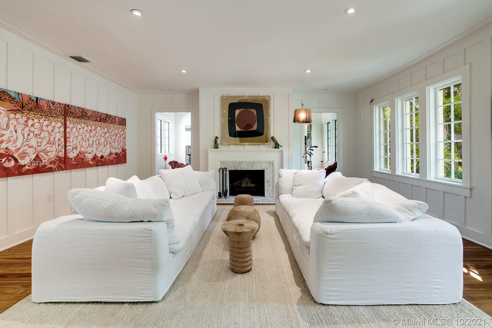 219 Ridgewood Road Coral Gables, FL 33133 - Photo 11 of 35 a living room with furniture fireplace and window