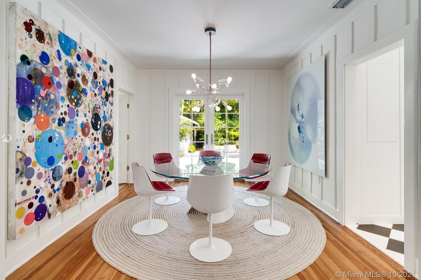 219 Ridgewood Road Coral Gables, FL 33133 - Photo 12 of 35 a dining room with furniture a rug and wooden floor