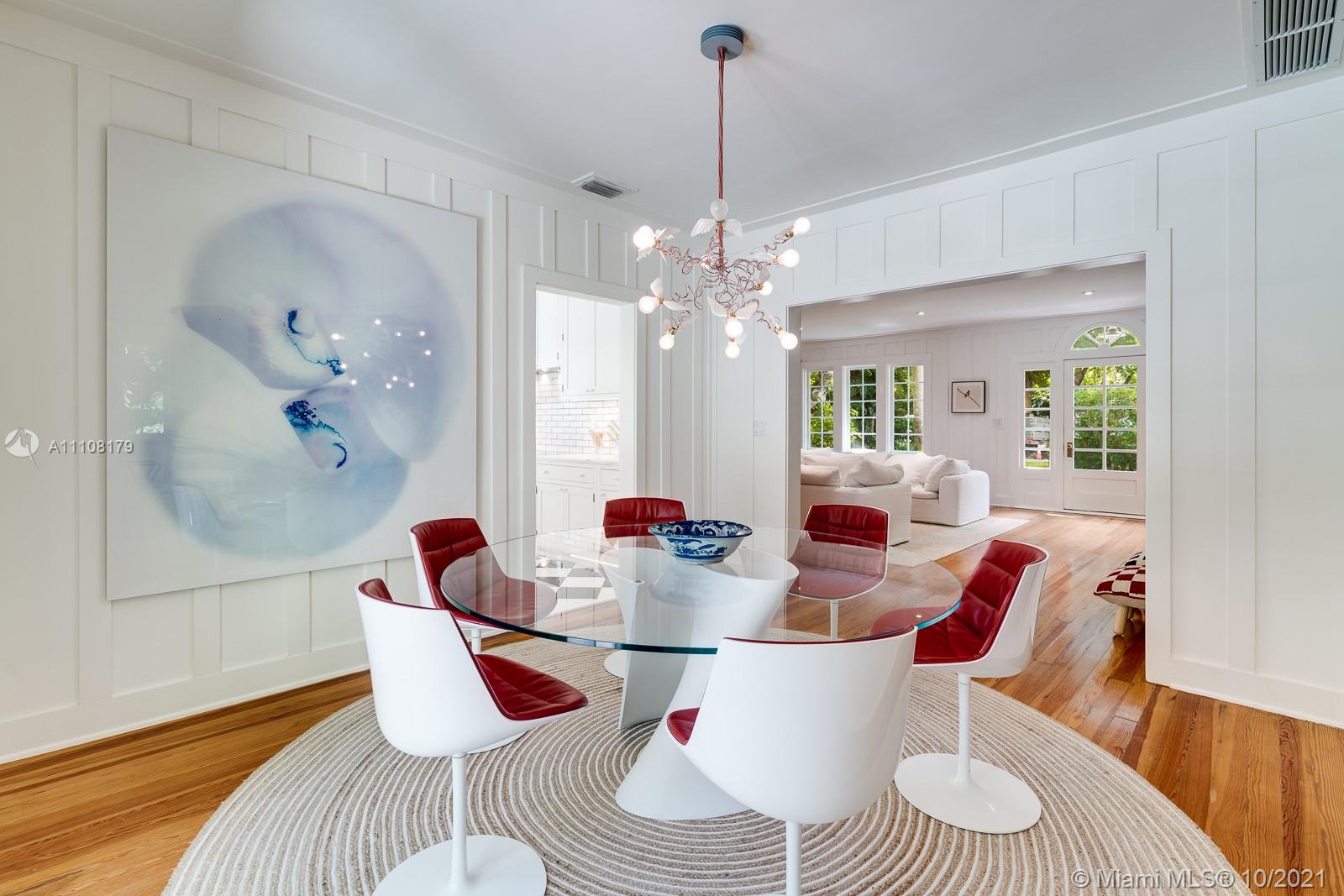 219 Ridgewood Road Coral Gables, FL 33133 - Photo 13 of 35 a dining room with furniture and wooden floor