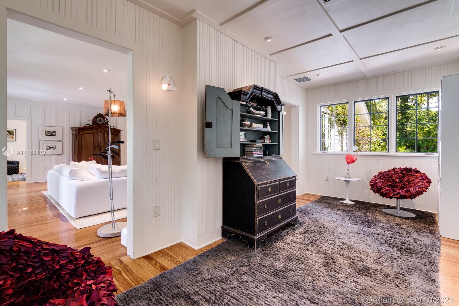 219 Ridgewood Road Coral Gables, FL 33133 - Photo 19 of 35 a bedroom with furniture and a window