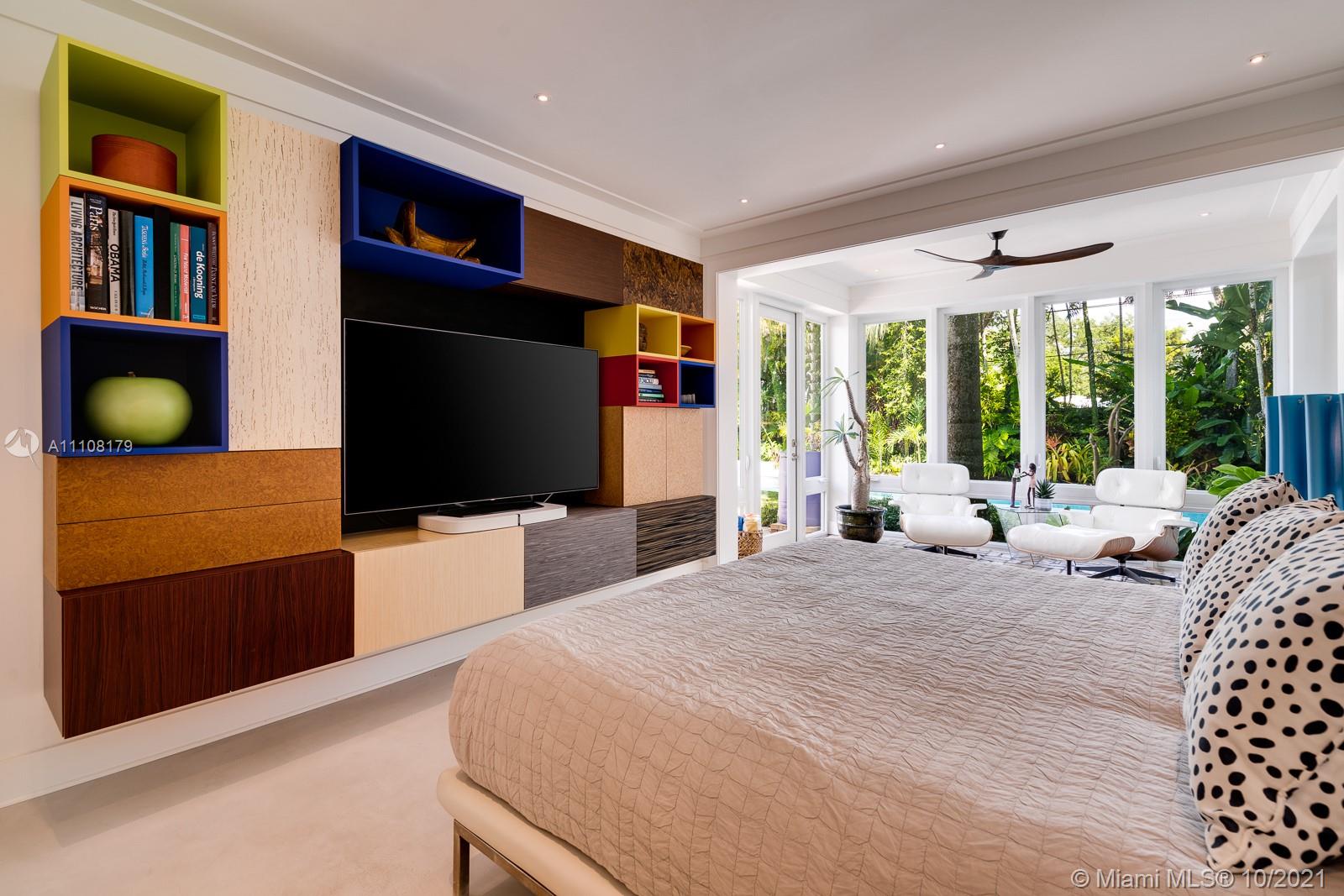 219 Ridgewood Road Coral Gables, FL 33133 - Photo 21 of 35 a bedroom with furniture and large windows