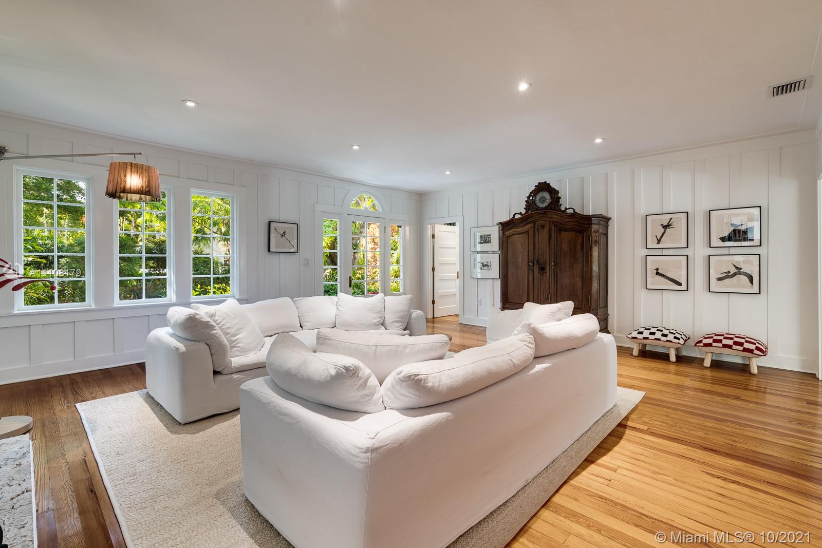 219 Ridgewood Road Coral Gables, FL 33133 - Photo 9 of 35 a living room with furniture and a large window