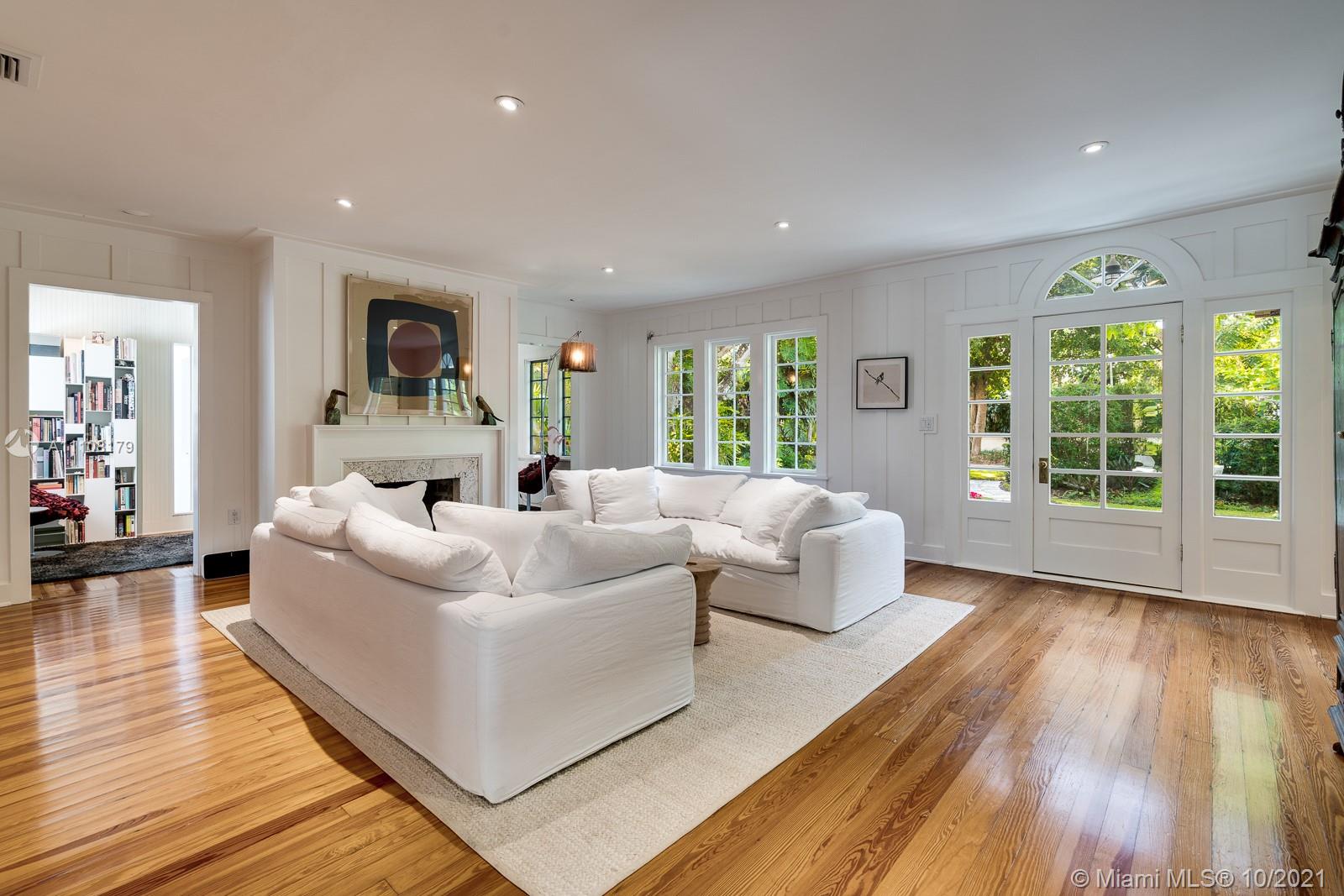 219 Ridgewood Road Coral Gables, FL 33133 - Photo 10 of 35 a living room with furniture and a large window
