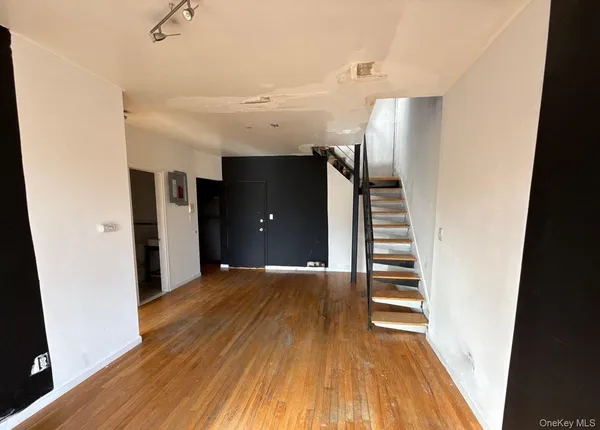 a view of entryway with wooden floor