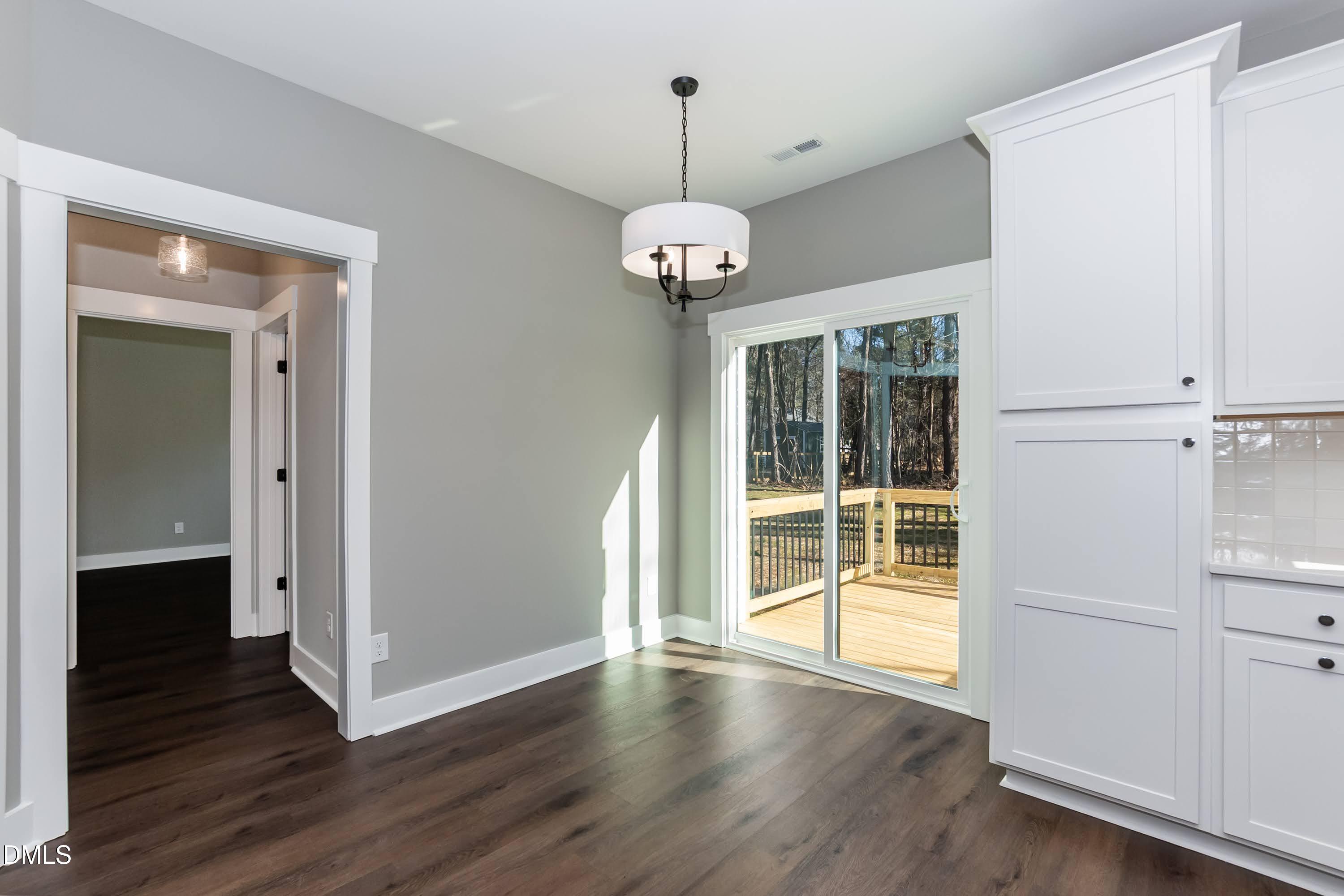104 Buffalo Drive Spring Hope, NC 27882 - Photo 16 of 48 wooden floor in an empty room with a window
