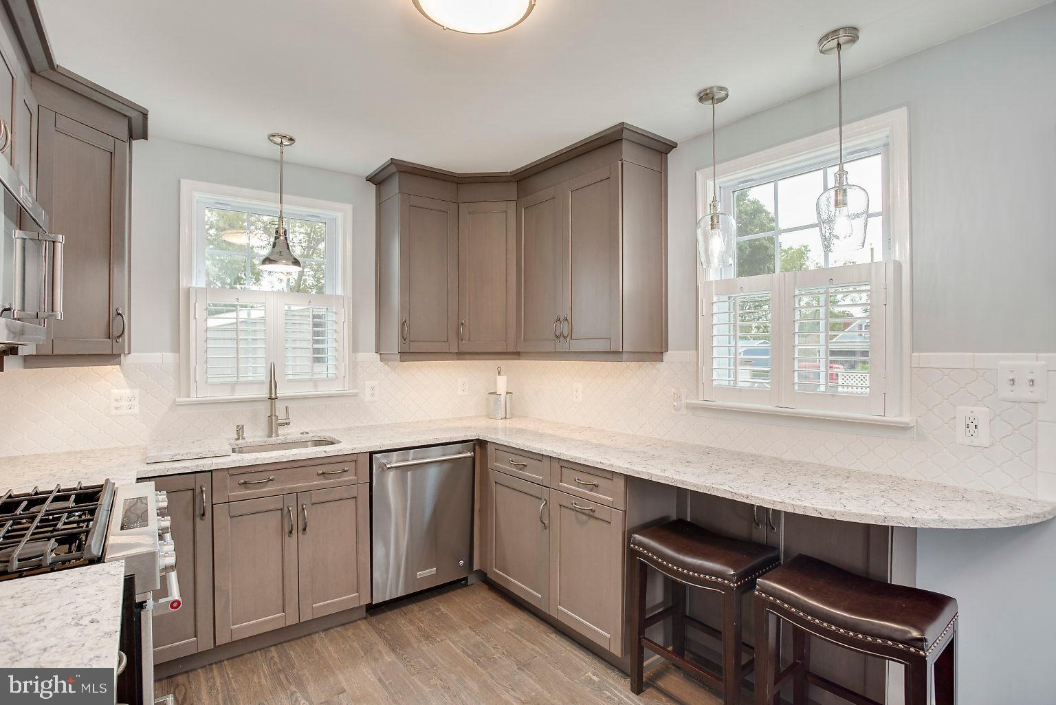 603 Seena Road Baltimore, MD 21221 - Photo 26 of 49 Hardwood floor/pendant lighting
