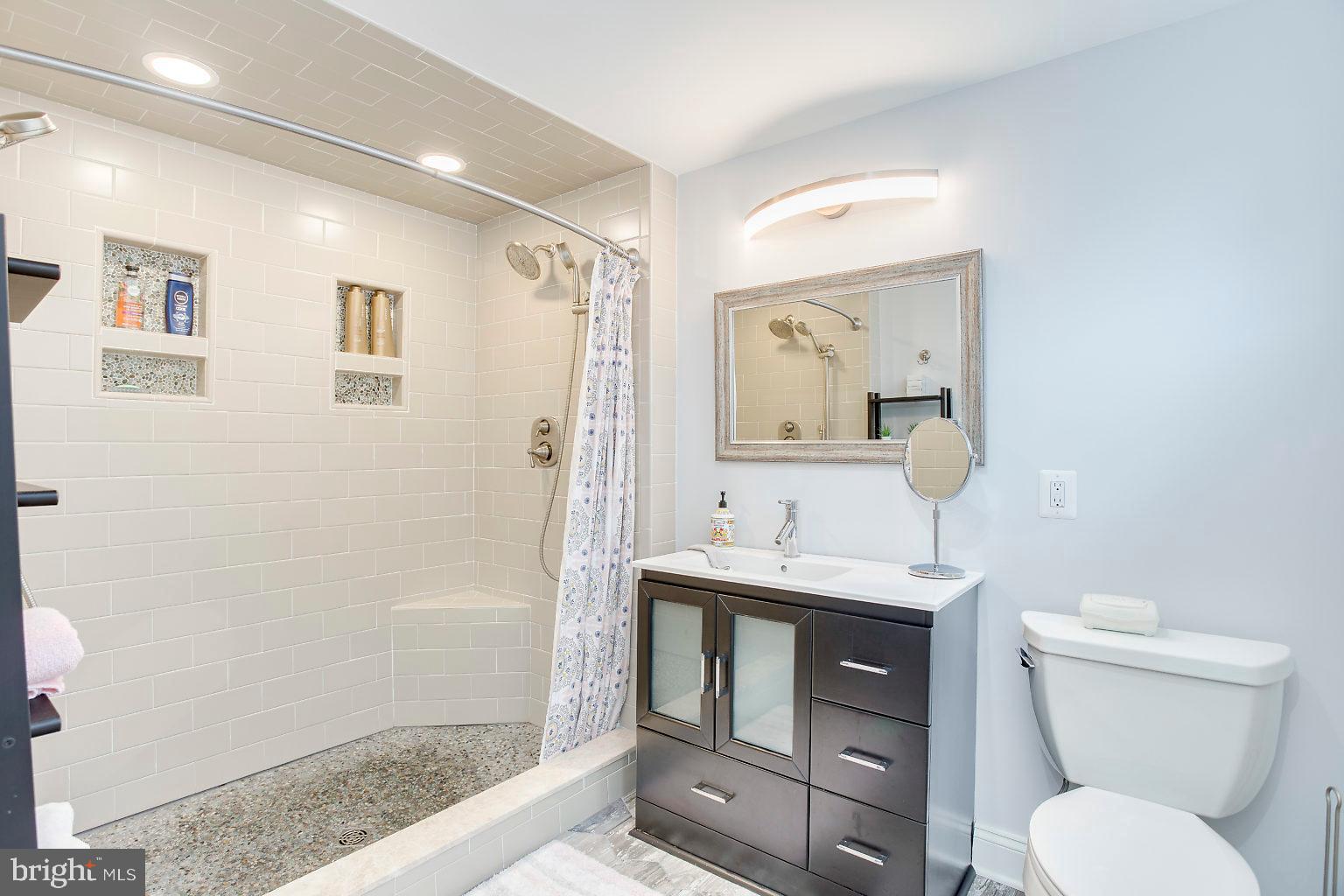 603 Seena Road Baltimore, MD 21221 - Photo 43 of 49 Master Bath Tiled Shower with dual shower heads