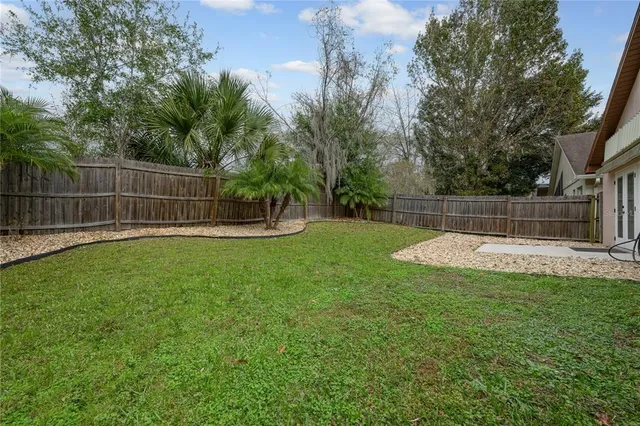 a view of a backyard with a small cabin