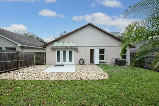 a front view of house with yard outdoor seating and barbeque oven